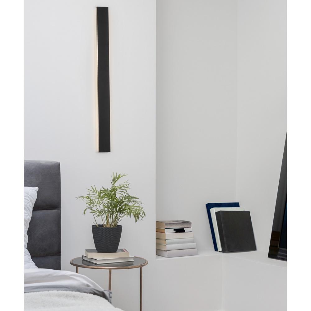 White,Bedroom,With,Round,Bedside,Table,With,Decorations,And,Books